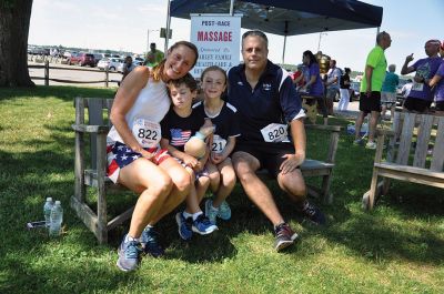 Race to the Finish 
July 4th morning in Mattapoisett means its time for the annual Mattapoisett July 4th Road Race, a five-miler that starts and finishes at Shipyard Park. The proceeds fund scholarships to ORR graduates. Photos by Sarah French Storer
