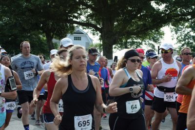 48th Annual Mattapoisett Road Race 
The 48th Annual Mattapoisett Road Race once again brought out young and old alike. Overcast skies were welcomed but the July 4th heat was tough for the runners and the cheering crowds who begged for shade. The field of runners was well over 1,000 and coming in first was Joe Farrand at 26:59. Shortly after, the first female to finish was Kim Bolick at 29:54. Before the starting gun sounded there was a moment of silence in honor of Maurice “Mudgie” Tavares who established the Mattapoisett Track Club, and the 
