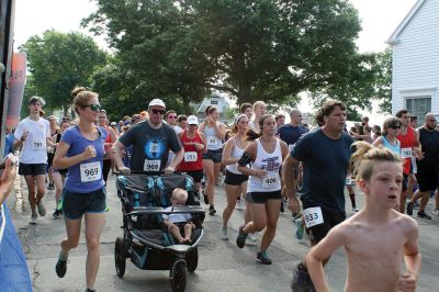 48th Annual Mattapoisett Road Race 
The 48th Annual Mattapoisett Road Race once again brought out young and old alike. Overcast skies were welcomed but the July 4th heat was tough for the runners and the cheering crowds who begged for shade. The field of runners was well over 1,000 and coming in first was Joe Farrand at 26:59. Shortly after, the first female to finish was Kim Bolick at 29:54. Before the starting gun sounded there was a moment of silence in honor of Maurice “Mudgie” Tavares who established the Mattapoisett Track Club, and the 
