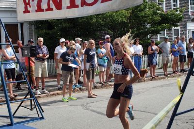 48th Annual Mattapoisett Road Race 
The 48th Annual Mattapoisett Road Race once again brought out young and old alike. Overcast skies were welcomed but the July 4th heat was tough for the runners and the cheering crowds who begged for shade. The field of runners was well over 1,000 and coming in first was Joe Farrand at 26:59. Shortly after, the first female to finish was Kim Bolick at 29:54. Before the starting gun sounded there was a moment of silence in honor of Maurice “Mudgie” Tavares who established the Mattapoisett Track Club, and the 
