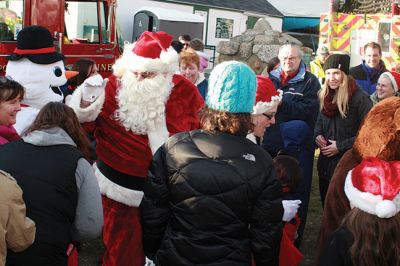 Mattapoisett Christmas
Santa, Rudolph, and Frosty -- plus food, crafts for kids, and the annual tree lighting are some of the hallmarks of a Mattapoisett Christmas. The Mattapoisett Lion’s Club in partnership with local businesses hosted the annual tree lighting at Shipyard Park on Saturday, December 13. The Lions also collected toys and canned goods in support of local charities. Photos by Marilou Newell
