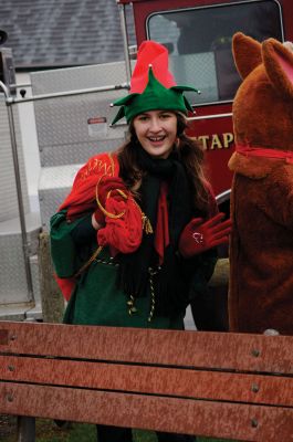 Santa Arrives
Mattapoisett held its annual holiday celebration and tree lighting on Saturday, December 5, 2009 at Shipyard Park. The rain couldn't dampen holiday spirits as visitors enjoyed delicious food and listened to Christmas music performed by the Showstoppers. Children made their own ornaments and hung them on the Christmas tree. They also danced with Rudolph and Frosty and shared their Christmas wishes with Santa Claus. Photo by Felix Perez.
