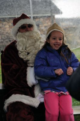 Santa Arrives
Mattapoisett held its annual holiday celebration and tree lighting on Saturday, December 5, 2009 at Shipyard Park. The rain couldn't dampen holiday spirits as visitors enjoyed delicious food and listened to Christmas music performed by the Showstoppers. Children made their own ornaments and hung them on the Christmas tree. They also danced with Rudolph and Frosty and shared their Christmas wishes with Santa Claus. Photo by Felix Perez.
