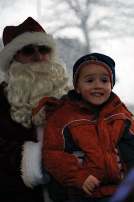 Santa Arrives
Mattapoisett held its annual holiday celebration and tree lighting on Saturday, December 5, 2009 at Shipyard Park. The rain couldn't dampen holiday spirits as visitors enjoyed delicious food and listened to Christmas music performed by the Showstoppers. Children made their own ornaments and hung them on the Christmas tree. They also danced with Rudolph and Frosty and shared their Christmas wishes with Santa Claus. Photo by Felix Perez.
