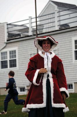 Santa Arrives
Mattapoisett held its annual holiday celebration and tree lighting on Saturday, December 5, 2009 at Shipyard Park. The rain couldn't dampen holiday spirits as visitors enjoyed delicious food and listened to Christmas music performed by the Showstoppers. Children made their own ornaments and hung them on the Christmas tree. They also danced with Rudolph and Frosty and shared their Christmas wishes with Santa Claus. Photo by Felix Perez.
