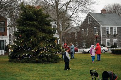 Santa Arrives
Mattapoisett held its annual holiday celebration and tree lighting on Saturday, December 5, 2009 at Shipyard Park. The rain couldn't dampen holiday spirits as visitors enjoyed delicious food and listened to Christmas music performed by the Showstoppers. Children made their own ornaments and hung them on the Christmas tree. They also danced with Rudolph and Frosty and shared their Christmas wishes with Santa Claus. Photo by Felix Perez.
