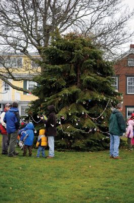 Santa Arrives
Mattapoisett held its annual holiday celebration and tree lighting on Saturday, December 5, 2009 at Shipyard Park. The rain couldn't dampen holiday spirits as visitors enjoyed delicious food and listened to Christmas music performed by the Showstoppers. Children made their own ornaments and hung them on the Christmas tree. They also danced with Rudolph and Frosty and shared their Christmas wishes with Santa Claus. Photo by Felix Perez.
