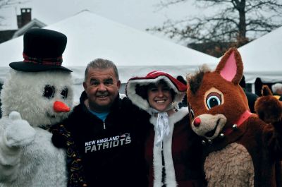 Santa Arrives
Mattapoisett held its annual holiday celebration and tree lighting on Saturday, December 5, 2009 at Shipyard Park. The rain couldn't dampen holiday spirits as visitors enjoyed delicious food and listened to Christmas music performed by the Showstoppers. Children made their own ornaments and hung them on the Christmas tree. They also danced with Rudolph and Frosty and shared their Christmas wishes with Santa Claus. Photo by Felix Perez.
