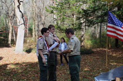 Veterans Day Ceremony in Mattapoiset
On November 11 following the Veterans Day Ceremony at Old Hammondtown School in Mattapoisett, members of Boy Scout Troop 53 performed a flag decommissioning ceremony at the Mattapoisett Land Trust’s Dunseith Gardens. Flags had been placed in decommissioning boxes built by Drew Robert for his Eagle project. The flags were then collected from the boxes located at the police department, town hall and public library and prepared for burning and burial. 
