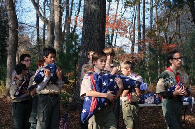 Veterans Day Ceremony in Mattapoiset
On November 11 following the Veterans Day Ceremony at Old Hammondtown School in Mattapoisett, members of Boy Scout Troop 53 performed a flag decommissioning ceremony at the Mattapoisett Land Trust’s Dunseith Gardens. Flags had been placed in decommissioning boxes built by Drew Robert for his Eagle project. The flags were then collected from the boxes located at the police department, town hall and public library and prepared for burning and burial. 
