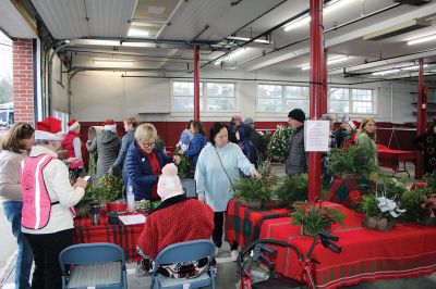 Mattapoisett Woman’s Club
Sandra Hering is decked out in Santa attire as she invites traffic to turn into Saturday morning’s sale of wreaths and other assorted Christmas decorations at the Fire Station on the corner of Route 6 and Barstow in Mattapoisett. The annual event, put on by the Mattapoisett Woman’s Club, raises money to fund a college scholarship. Photos by Mick Colageo

