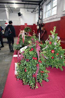 Mattapoisett Woman’s Club
Sandra Hering is decked out in Santa attire as she invites traffic to turn into Saturday morning’s sale of wreaths and other assorted Christmas decorations at the Fire Station on the corner of Route 6 and Barstow in Mattapoisett. The annual event, put on by the Mattapoisett Woman’s Club, raises money to fund a college scholarship. Photos by Mick Colageo
