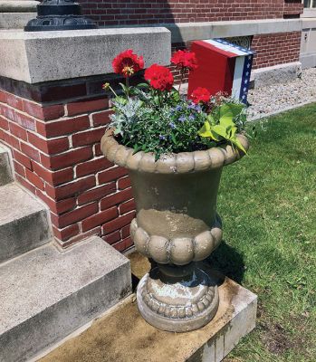 Mattapoisett Woman’s Club Garden Group
Red, white, and blue was Sharon Doyon’s vision of the Mattapoisett Woman’s Club Garden Group as 18 members gathered at the library to plant on May 26 in areas including the pots at the Mattapoisett Historical Society and Town Hall, window boxes at the post office and Town Beach house, the lighthouse garden at the harbor, plus the gardens and planters at the Mattapoisett Free Public Library. 
