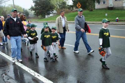 Opening Day
The Mattapoisett Youth Baseball League opened their 2009 season with a parade down Route Six on Saturday morning, May 2. Special guest and Boston Red Sox mascot Wally the Green Monster was on hand to throw out the first pitch and sign autographs for the young players. Photo by Robert Chiarito.
