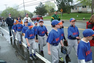 Opening Day
The Mattapoisett Youth Baseball League opened their 2009 season with a parade down Route Six on Saturday morning, May 2. Special guest and Boston Red Sox mascot Wally the Green Monster was on hand to throw out the first pitch and sign autographs for the young players. Photo by Robert Chiarito.
