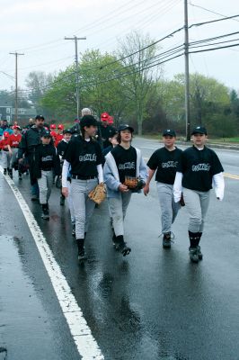 Opening Day
The Mattapoisett Youth Baseball League opened their 2009 season with a parade down Route Six on Saturday morning, May 2. Special guest and Boston Red Sox mascot Wally the Green Monster was on hand to throw out the first pitch and sign autographs for the young players. Photo by Robert Chiarito.
