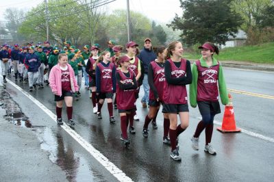 Opening Day
The Mattapoisett Youth Baseball League opened their 2009 season with a parade down Route Six on Saturday morning, May 2. Special guest and Boston Red Sox mascot Wally the Green Monster was on hand to throw out the first pitch and sign autographs for the young players. Photo by Robert Chiarito.
