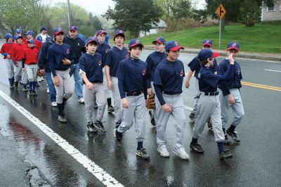 Opening Day
The Mattapoisett Youth Baseball League opened their 2009 season with a parade down Route Six on Saturday morning, May 2. Special guest and Boston Red Sox mascot Wally the Green Monster was on hand to throw out the first pitch and sign autographs for the young players. Photo by Robert Chiarito.
