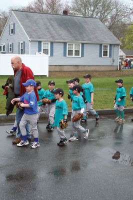 Opening Day
The Mattapoisett Youth Baseball League opened their 2009 season with a parade down Route Six on Saturday morning, May 2. Special guest and Boston Red Sox mascot Wally the Green Monster was on hand to throw out the first pitch and sign autographs for the young players. Photo by Robert Chiarito.
