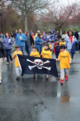 Opening Day
The Mattapoisett Youth Baseball League opened their 2009 season with a parade down Route Six on Saturday morning, May 2. Special guest and Boston Red Sox mascot Wally the Green Monster was on hand to throw out the first pitch and sign autographs for the young players. Photo by Robert Chiarito.
