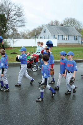 Opening Day
The Mattapoisett Youth Baseball League opened their 2009 season with a parade down Route Six on Saturday morning, May 2. Special guest and Boston Red Sox mascot Wally the Green Monster was on hand to throw out the first pitch and sign autographs for the young players. Photo by Robert Chiarito.
