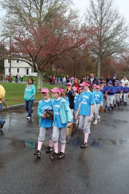 Opening Day
The Mattapoisett Youth Baseball League opened their 2009 season with a parade down Route Six on Saturday morning, May 2. Special guest and Boston Red Sox mascot Wally the Green Monster was on hand to throw out the first pitch and sign autographs for the young players. Photo by Robert Chiarito.
