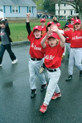 Opening Day
The Mattapoisett Youth Baseball League opened their 2009 season with a parade down Route Six on Saturday morning, May 2. Special guest and Boston Red Sox mascot Wally the Green Monster was on hand to throw out the first pitch and sign autographs for the young players. Photo by Robert Chiarito.
