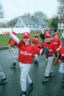 Opening Day
The Mattapoisett Youth Baseball League opened their 2009 season with a parade down Route Six on Saturday morning, May 2. Special guest and Boston Red Sox mascot Wally the Green Monster was on hand to throw out the first pitch and sign autographs for the young players. Photo by Robert Chiarito.
