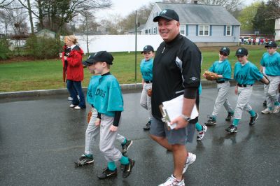 Opening Day
The Mattapoisett Youth Baseball League opened their 2009 season with a parade down Route Six on Saturday morning, May 2. Special guest and Boston Red Sox mascot Wally the Green Monster was on hand to throw out the first pitch and sign autographs for the young players. Photo by Robert Chiarito.
