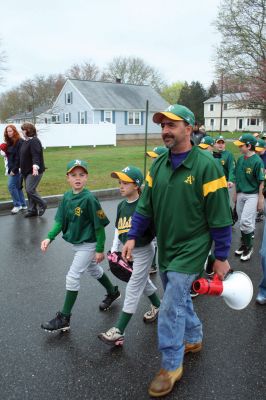 Opening Day
The Mattapoisett Youth Baseball League opened their 2009 season with a parade down Route Six on Saturday morning, May 2. Special guest and Boston Red Sox mascot Wally the Green Monster was on hand to throw out the first pitch and sign autographs for the young players. Photo by Robert Chiarito.
