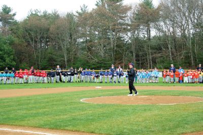 Opening Day
The Mattapoisett Youth Baseball League opened their 2009 season with a parade down Route Six on Saturday morning, May 2. Special guest and Boston Red Sox mascot Wally the Green Monster was on hand to throw out the first pitch and sign autographs for the young players. Photo by Robert Chiarito.
