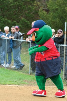 Opening Day
The Mattapoisett Youth Baseball League opened their 2009 season with a parade down Route Six on Saturday morning, May 2. Special guest and Boston Red Sox mascot Wally the Green Monster was on hand to throw out the first pitch and sign autographs for the young players. Photo by Robert Chiarito.
