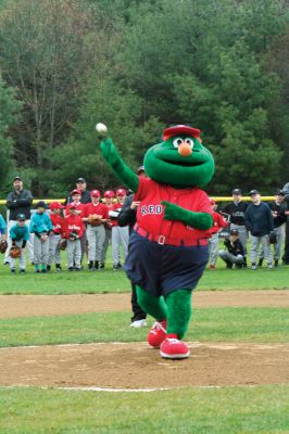 Opening Day
The Mattapoisett Youth Baseball League opened their 2009 season with a parade down Route Six on Saturday morning, May 2. Special guest and Boston Red Sox mascot Wally the Green Monster was on hand to throw out the first pitch and sign autographs for the young players. Photo by Robert Chiarito.
