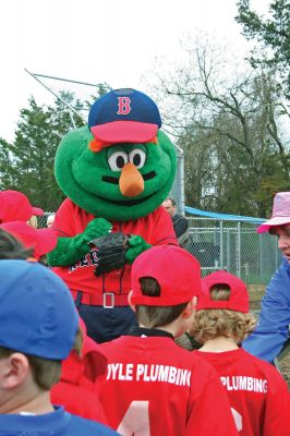 Opening Day
The Mattapoisett Youth Baseball League opened their 2009 season with a parade down Route Six on Saturday morning, May 2. Special guest and Boston Red Sox mascot Wally the Green Monster was on hand to throw out the first pitch and sign autographs for the young players. Photo by Robert Chiarito.
