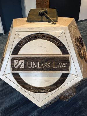 John Magnan
Mattapoisett resident and wood sculptor John Magnan's installation featured in the UMass Law School in Dartmouth lobby is based on the theme of justice for all and the hope of justice, understanding and inclusion. The pieces, impressive for their size and beauty as drawn together under the title of the Arc of Justice, demonstrate Magnan's superior artistic skills and humanitarian sensibilities. Photos by Marilou Newell
