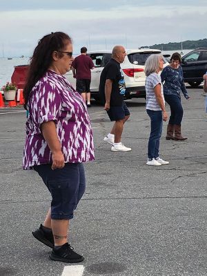 Boot Scootin’ 
The Friends of the Mattapoisett Council on Aging sponsored their second Boot Scootin’ Line Dance class on the wharves of Shipyard Park on Thursday August 11. Photo by Marilou Newell
