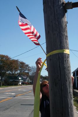 Welcome Home
Marine Corps Lance Corporal and Mattapoisett resident Greg Rosperich, returned from a second tour of duty in Afghanistan last week. Army Sergeant Ryan McGrath also returned on Thursday, September 1. Mattapoisett resident Kim Corazzini, a friend of the Rosperich family, led over 20 volunteers to give the men a proper welcome, which included lining Route 6 with yellow ribbons, American flags and welcome home signs. Photo by Anne Kakley. September 8, 2011 edition
