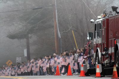 Marine Becket Kiernan
On Friday, February 16, Class of 2017 ORR graduate and 18-year-old Marine Becket Kiernan was laid to rest at the Massachusetts National Cemetery in Bourne. All of Old Rochester lined the side of Route 6 for a final farewell to Becket as Principal Mike Devoll stood solemnly as the procession passed beneath the giant U.S. flag suspended by two local ladder trucks. Fire and police from all three towns lined the opposite side of the street to pay their respects. Photos by Jean Perry
