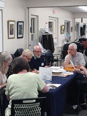 Marion Election
Marion Town Clerk Lissa Magauran, left, and her team of volunteers including Lisa McLean (back turned), Cynthia Callow, Paul Naiman, Dick Giberti and Tom Magauran (not pictured) recounted votes after the polls closed on Friday night at the Cushing Community Center. The well-attended May 13 Town Election resulted in the installation of Carleton “Toby” Burr as a Select Board member and of Tucker Burr, his son, and Andrew Daniel as new Planning Board members. Photo by Marilou Newell - May 19, 2022 edition
