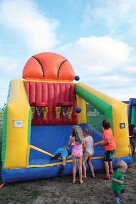 Marion Town Party
 Marion Town Party on August 27 at Silvershell Beach. Inflatable arcade games, cornhole, an informal football toss and an undefinable ball game inside a walled octagon kept kids running and laughing, while their parents and grandparents socialized over barbecue and beverages. Photos by Mick Colageo
