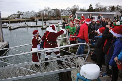 Marion Village Christmas Stroll
Despite eventual rain, the Marion Village Christmas Stroll was enjoyed by many on Sunday afternoon. The event included musical entertainment by Tri-County musicians, Grades 4 and 5 bands from Sippican Elementary School, Sippican Historical Society carolers and Tabor Academy students, horse-drawn carriage rides, street entertainment, seasonal refreshments courtesy of area merchants, goodie bags from VASE, and crafts for kids. Photos by Mick Colageo
