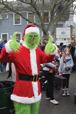 Marion Village Christmas Stroll
Despite eventual rain, the Marion Village Christmas Stroll was enjoyed by many on Sunday afternoon. The event included musical entertainment by Tri-County musicians, Grades 4 and 5 bands from Sippican Elementary School, Sippican Historical Society carolers and Tabor Academy students, horse-drawn carriage rides, street entertainment, seasonal refreshments courtesy of area merchants, goodie bags from VASE, and crafts for kids. Photos by Mick Colageo
