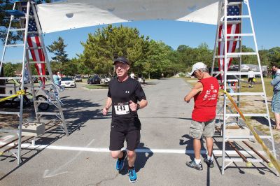 Marion Village 5K
The number of participants in this year’s Marion Village 5K might have been down slightly according to race organizers, but the sentiment of fun and competition certainly was not on Saturday, June 25. Taking first place for men was Andrew Sukeforth of Middleboro with a time of 15:43, and Meg Hughes of Rochester won first place in the women’s division with a time of 19:50. The annual 5K race that winds its way through scenic Marion village is now in its 20th year. Photos by Colin Veitch
