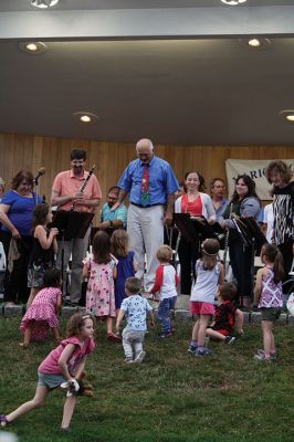 Young People’s Concert
The Marion Concert Band catered to the young ones on July 27 during its children’s-themed performance, “Young People’s Concert,” with selected songs familiar to children. Here, band conductor Tobias Monte sits onstage with the children, firing up their imaginations, and handing out instruments for the children to experiment with. Photos by Jean Perry
