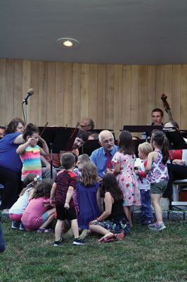 Young People’s Concert
The Marion Concert Band catered to the young ones on July 27 during its children’s-themed performance, “Young People’s Concert,” with selected songs familiar to children. Here, band conductor Tobias Monte sits onstage with the children, firing up their imaginations, and handing out instruments for the children to experiment with. Photos by Jean Perry
