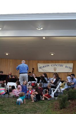 Young People’s Concert
The Marion Concert Band catered to the young ones on July 27 during its children’s-themed performance, “Young People’s Concert,” with selected songs familiar to children. Here, band conductor Tobias Monte sits onstage with the children, firing up their imaginations, and handing out instruments for the children to experiment with. Photos by Jean Perry
