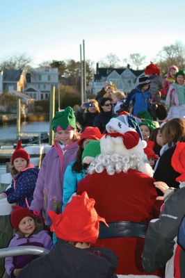 Marion Village Stroll
There were hundreds strolling the streets during the 2014 Marion Holiday Stroll on December 14. Celebrity sightings included Santa Claus on his carriage, the Grinch, the Nutcracker, and Sparky the Fire Dog. The Showstoppers and The Sippican School Marching Band lit up the afternoon until the tree lighting ceremony lit up the night, the finale of that starry-skied evening. Photos by Felix Perez and Jean Perry 
