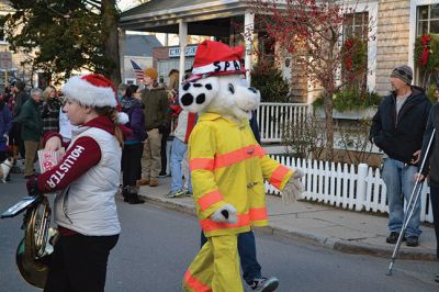 Marion Village Stroll
There were hundreds strolling the streets during the 2014 Marion Holiday Stroll on December 14. Celebrity sightings included Santa Claus on his carriage, the Grinch, the Nutcracker, and Sparky the Fire Dog. The Showstoppers and The Sippican School Marching Band lit up the afternoon until the tree lighting ceremony lit up the night, the finale of that starry-skied evening. Photos by Felix Perez and Jean Perry 
