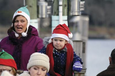 Marion Holiday Stroll
The Marion village streets were filled with holiday revelers on Sunday, December 9, for the annual Marion Holiday Stroll. Santa’s boat docked at the Marion Wharf where the faces of hundreds of children lit up at his arrival. Santa boarded a horse-drawn carriage and paraded through the streets, passing businesses offering free goodies and dodging the whereabouts of that old Grinch who didn’t seem to mind Christmas coming at all this year. Photos by Jean Perry
