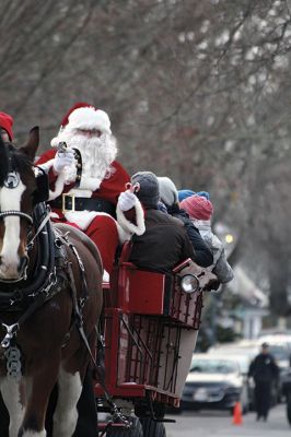 Marion Holiday Stroll
The Marion village streets were filled with holiday revelers on Sunday, December 9, for the annual Marion Holiday Stroll. Santa’s boat docked at the Marion Wharf where the faces of hundreds of children lit up at his arrival. Santa boarded a horse-drawn carriage and paraded through the streets, passing businesses offering free goodies and dodging the whereabouts of that old Grinch who didn’t seem to mind Christmas coming at all this year. Photos by Jean Perry
